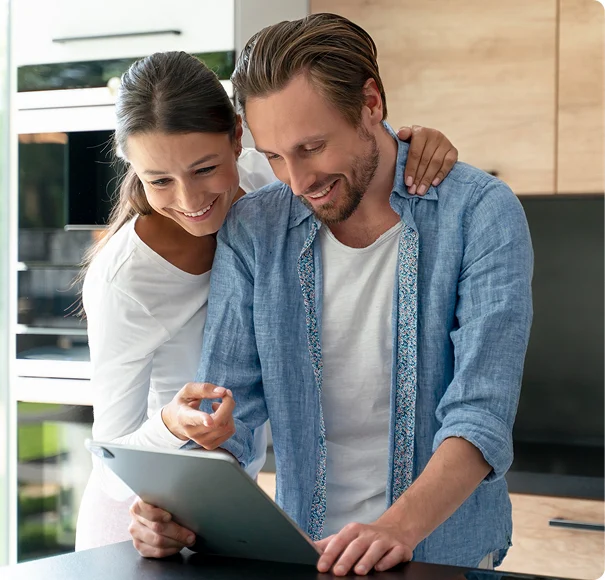 Couple reviewing home service information on a tablet